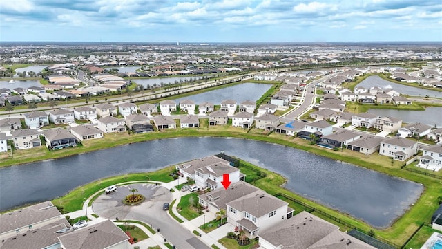 aerial view featuring a water view and a residential view