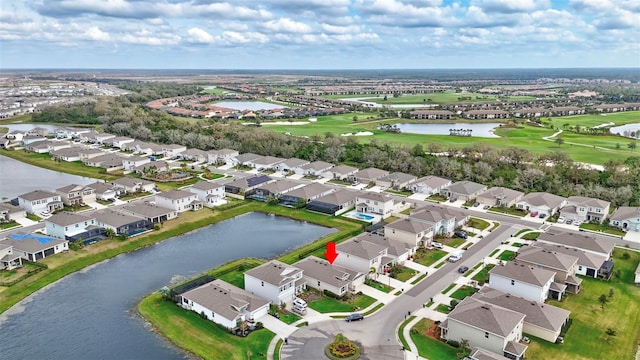 aerial view featuring a water view, a residential view, and view of golf course
