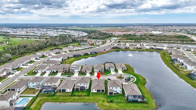 drone / aerial view with a water view and a residential view