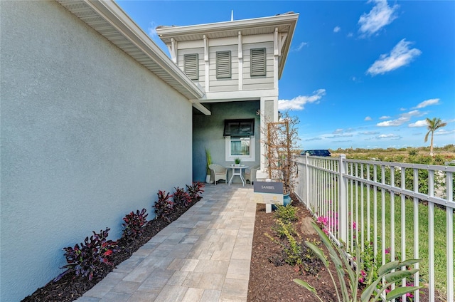 view of side of home featuring a patio area