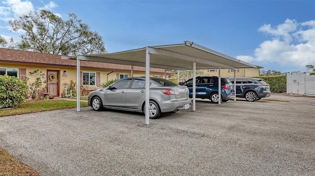 view of partially covered parking lot