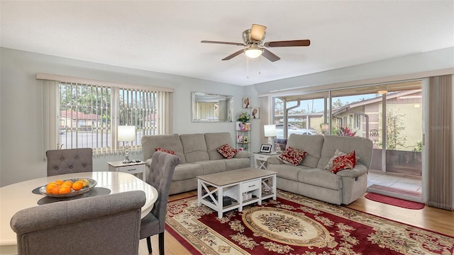 living room featuring ceiling fan and wood finished floors