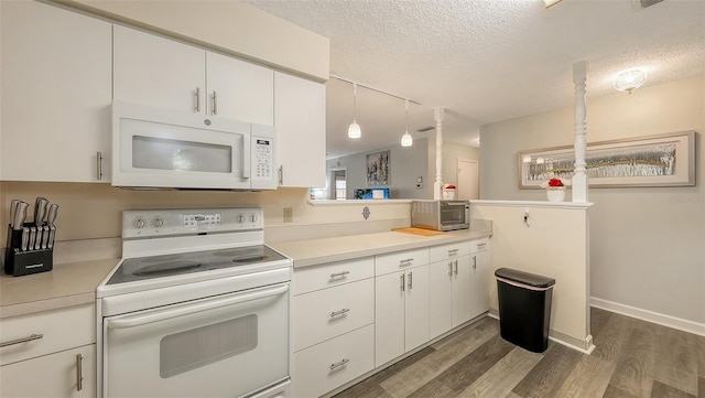 kitchen featuring a textured ceiling, white appliances, white cabinets, light countertops, and pendant lighting