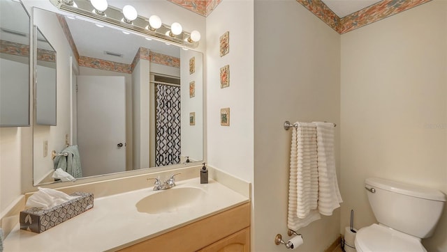 full bathroom featuring visible vents, vanity, and toilet