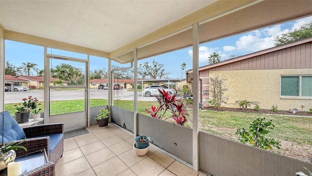 sunroom featuring a residential view