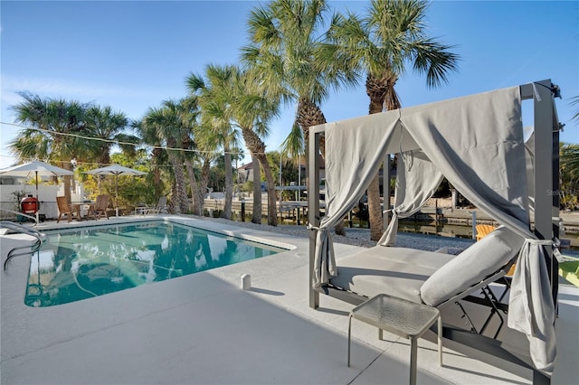 view of swimming pool with a patio and a fenced in pool