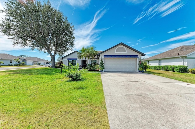 ranch-style house with a front lawn, concrete driveway, a garage, and stucco siding