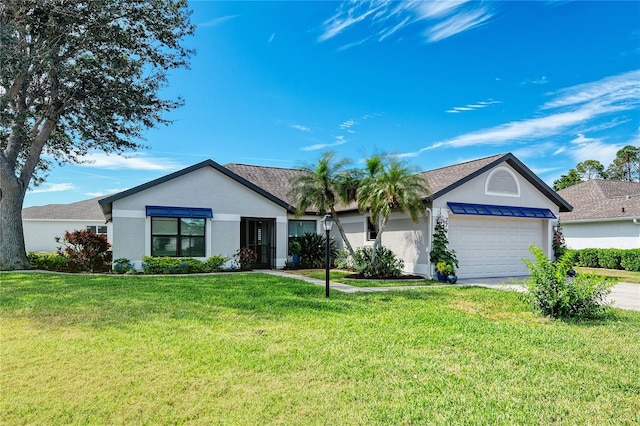 single story home with a front lawn, a garage, driveway, and stucco siding