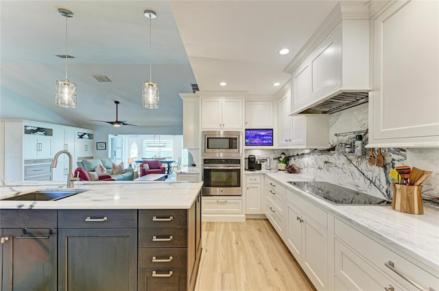 kitchen with premium range hood, appliances with stainless steel finishes, and white cabinets