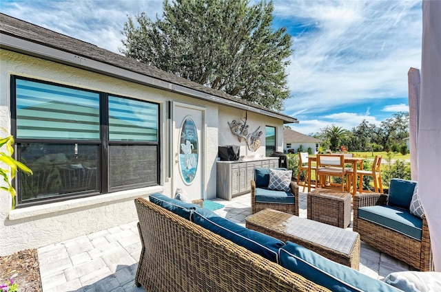 view of patio / terrace featuring an outdoor hangout area and outdoor dining space