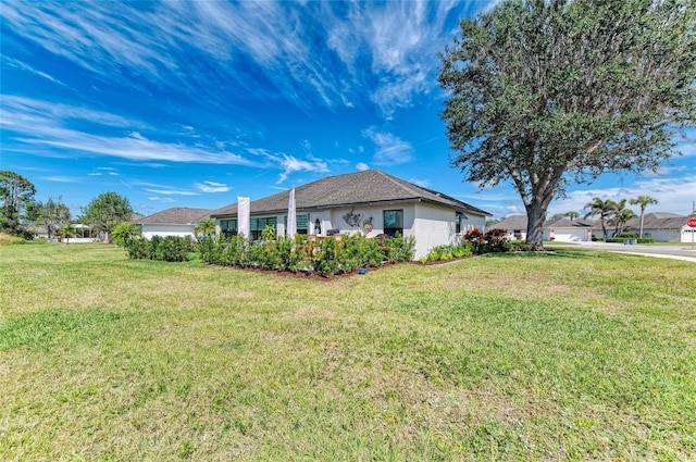 view of property exterior with a yard and stucco siding