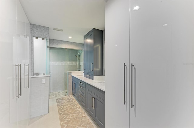 full bath with visible vents, double vanity, recessed lighting, tile patterned flooring, and a shower stall