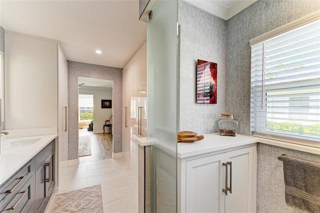 bathroom with tile patterned floors, recessed lighting, wallpapered walls, and vanity