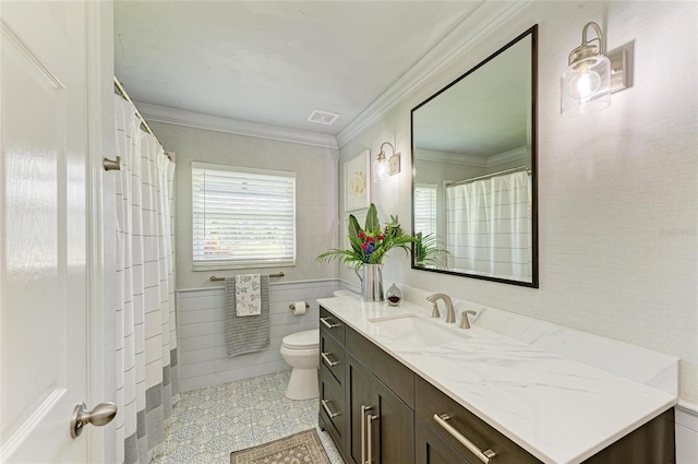 bathroom with visible vents, a wainscoted wall, toilet, ornamental molding, and vanity