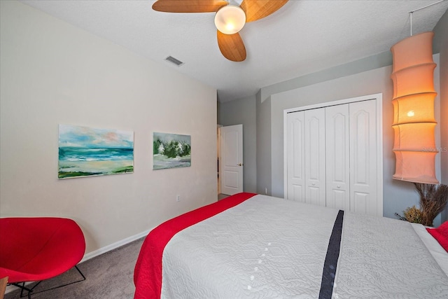 bedroom featuring carpet floors, a closet, and ceiling fan