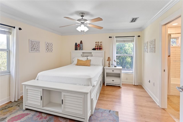 bedroom with a ceiling fan, visible vents, baseboards, ornamental molding, and light wood-type flooring