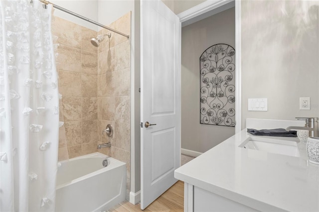 bathroom featuring shower / tub combo with curtain, vanity, and hardwood / wood-style flooring