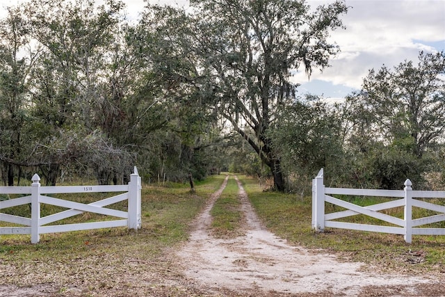 view of gate featuring fence