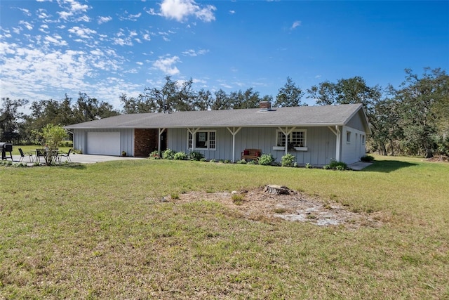 ranch-style house with an attached garage, a front lawn, and board and batten siding