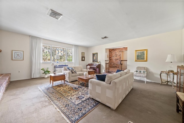 living area featuring visible vents and baseboards