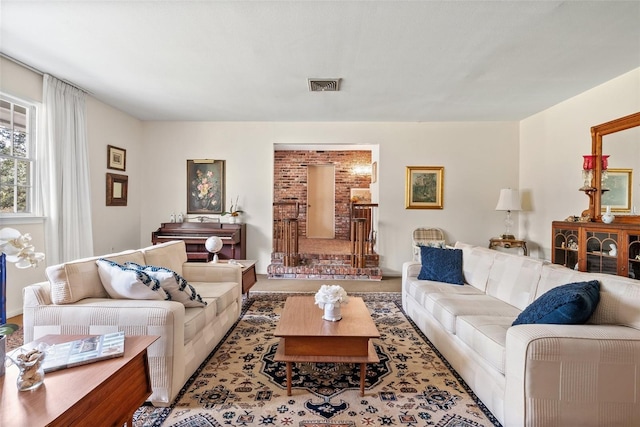 living room featuring visible vents