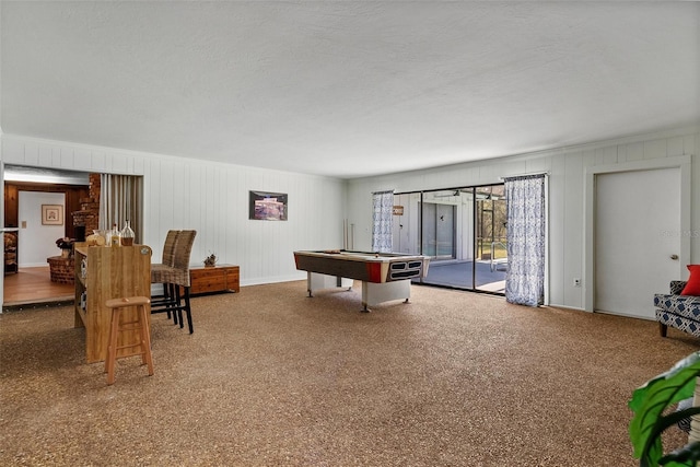 recreation room with pool table, a textured ceiling, and carpet flooring