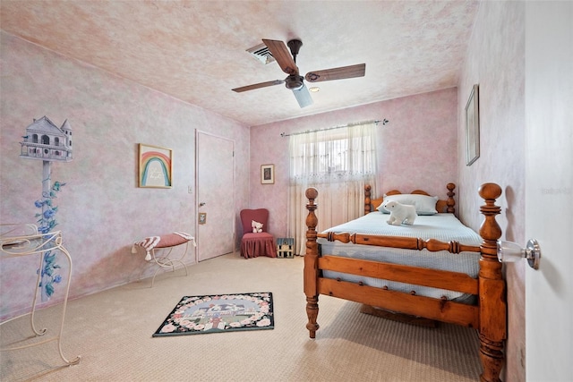 carpeted bedroom featuring visible vents and a ceiling fan