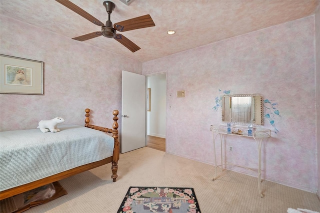 bedroom featuring a ceiling fan and light colored carpet