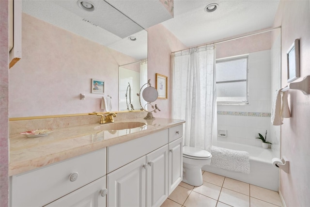 full bath featuring toilet, tile patterned floors, shower / bath combo with shower curtain, a textured ceiling, and vanity