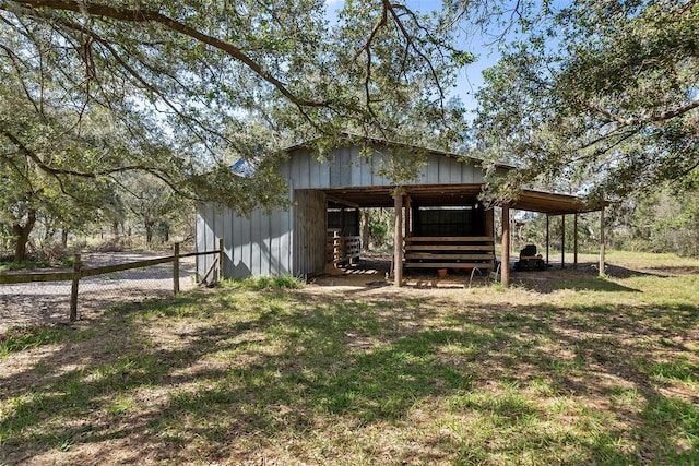 view of outbuilding featuring a carport and an outdoor structure