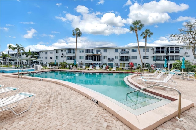 community pool featuring a patio area