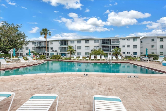 community pool featuring a patio area