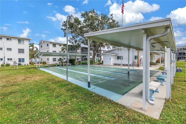 surrounding community with a residential view, a yard, and shuffleboard