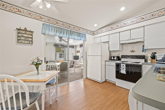 kitchen with light countertops, light wood-style flooring, white cabinetry, white appliances, and under cabinet range hood