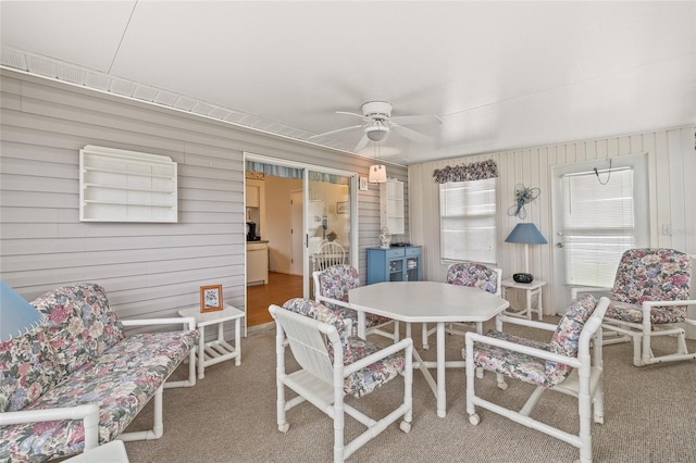 sunroom / solarium with ceiling fan