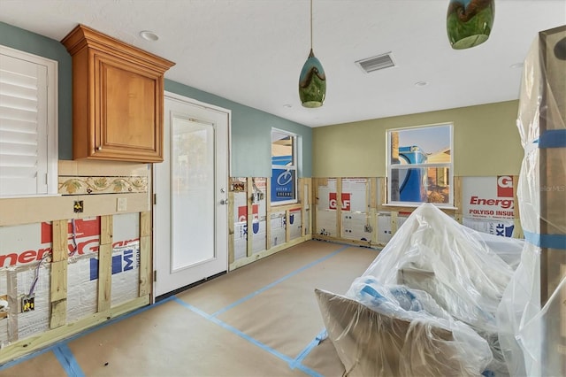 rec room featuring visible vents, concrete flooring, and a wealth of natural light