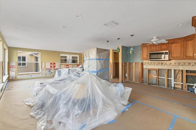 miscellaneous room with ceiling fan and visible vents