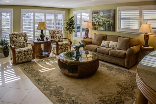 living room featuring light tile patterned floors, a wealth of natural light, and recessed lighting