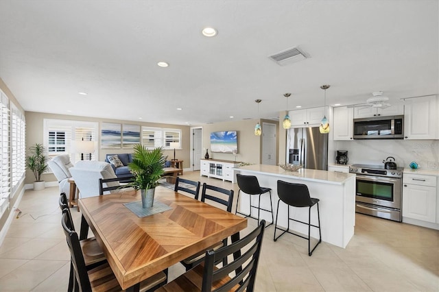 6140 Midnight Pass Rd Unit A10, Sarasota, FL 34242 - dining space with light tile patterned floors and recessed lighting