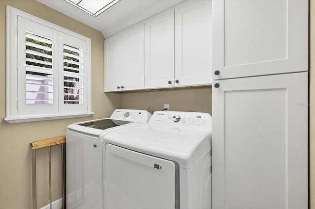 6140 Midnight Pass Rd Unit A10, Sarasota, FL 34242 - washroom with washing machine and clothes dryer and cabinet space