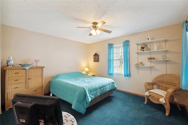 bedroom featuring baseboards, a textured ceiling, a ceiling fan, and carpet flooring