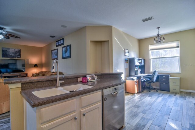 kitchen with open floor plan, white cabinetry, dishwasher, and visible vents