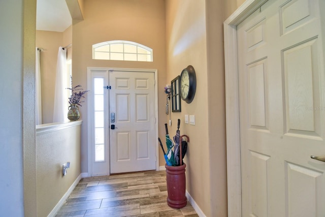 entrance foyer featuring baseboards and light wood-style floors