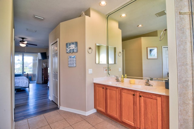 12286 23rd St E, Parrish, FL 34219 - ensuite bathroom with tile patterned floors, a ceiling fan, double vanity, and recessed lighting