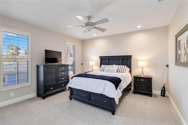 bedroom featuring light carpet, ceiling fan, recessed lighting, and baseboards