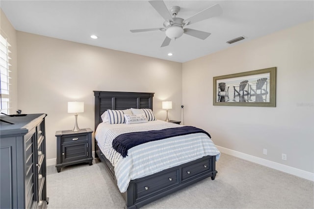 bedroom with recessed lighting, visible vents, light carpet, and baseboards