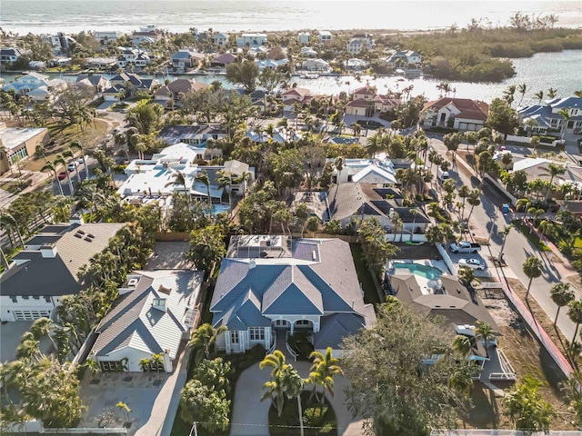 bird's eye view featuring a residential view and a water view