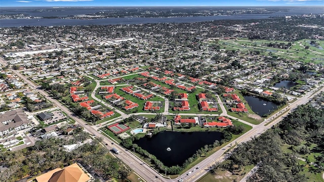 drone / aerial view featuring a water view and a residential view