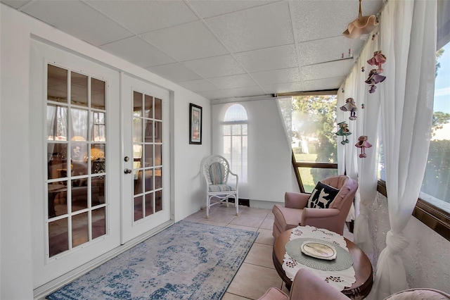 sunroom with french doors and a drop ceiling