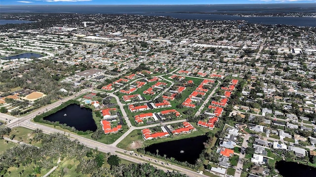 bird's eye view with a water view and a residential view